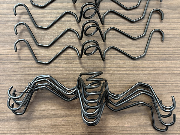 Greenhouse wiggle wire for poly film lock channel